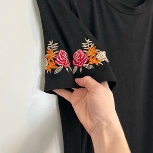 Black top with flower detailed sleeve